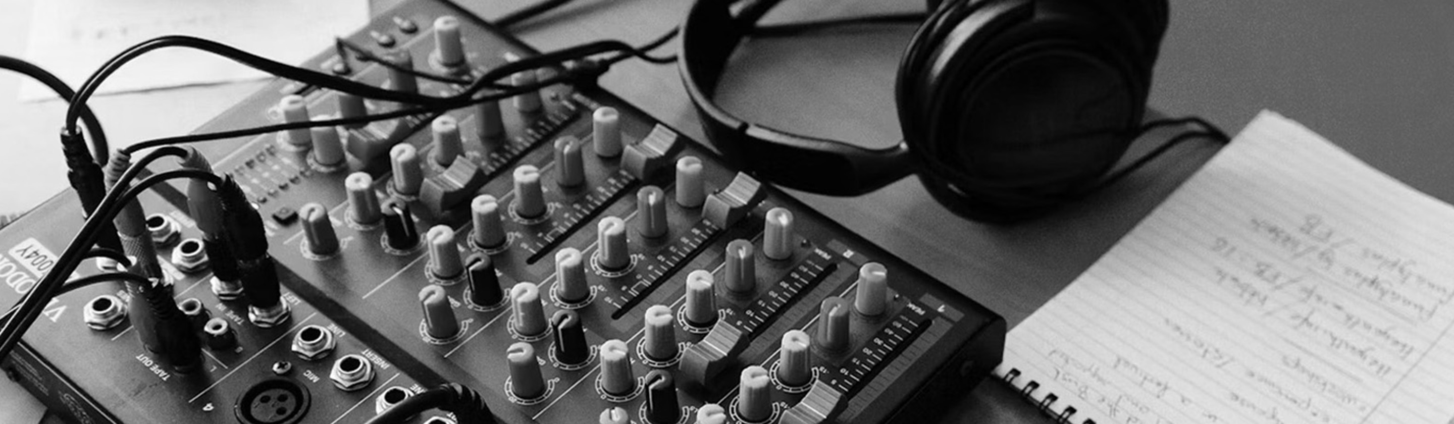 Image of microphone, headphones and radio equipment
