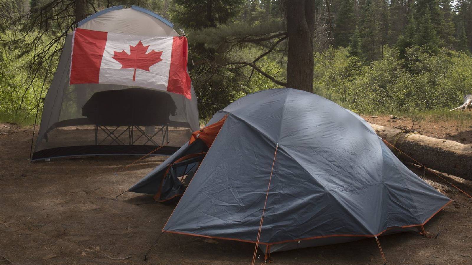 Campers with Canadian flag flying on their camp site are shown in Algonquin Park Saturday June 12, 2021. THE CANADIAN PRESS/Fred Thornhill Fred Thornhill