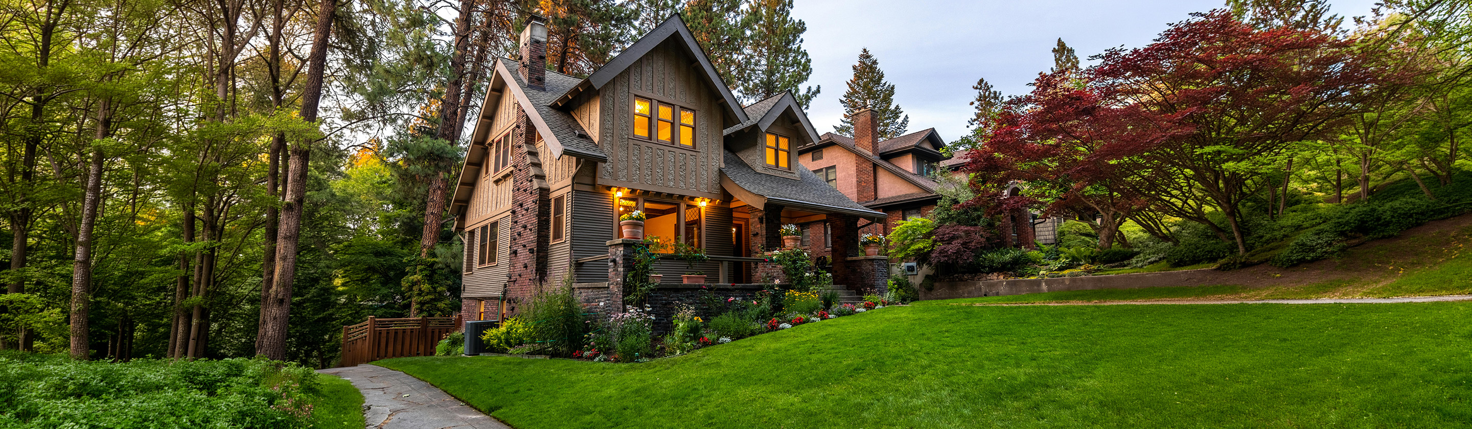 Image of upscale home with nice green front lawn