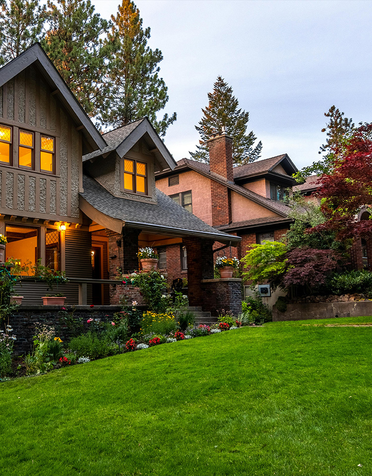 Image of upscale home with nice green front lawn