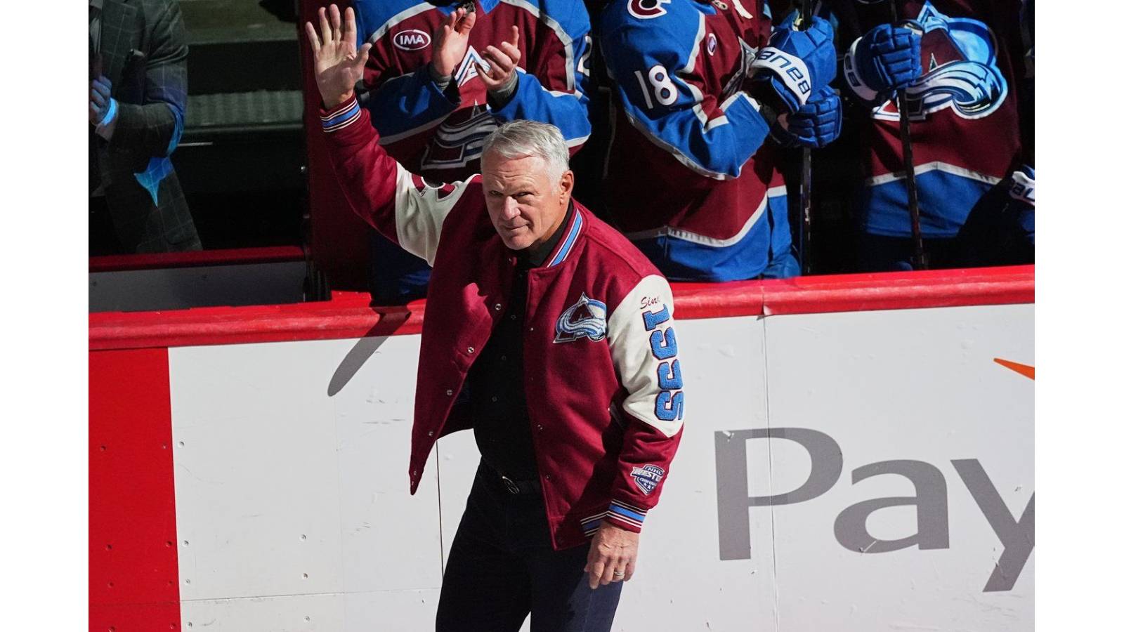 Image of Claude waving to the crowd