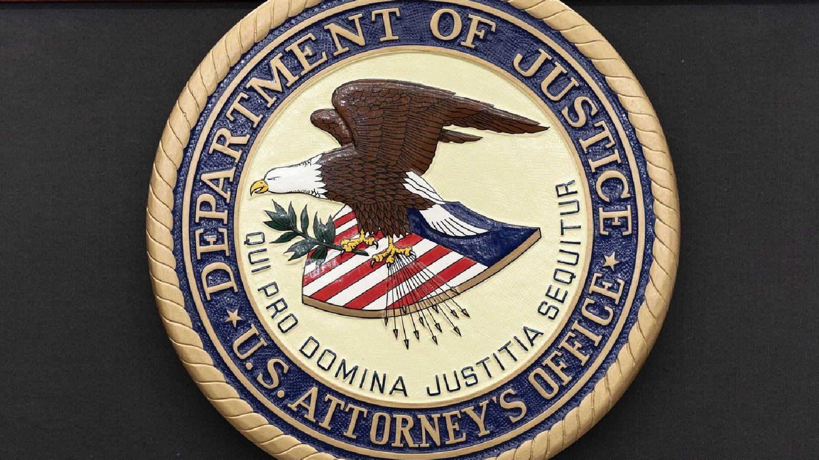 The seal of Department of Justice U.S. Attorney's Office is seen during a news conference in Washington, Thursday, May 22, 2025.