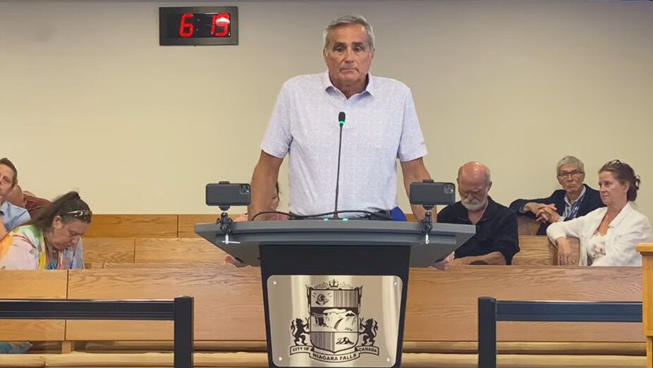 Ken Todd standing before Niagara Falls city council